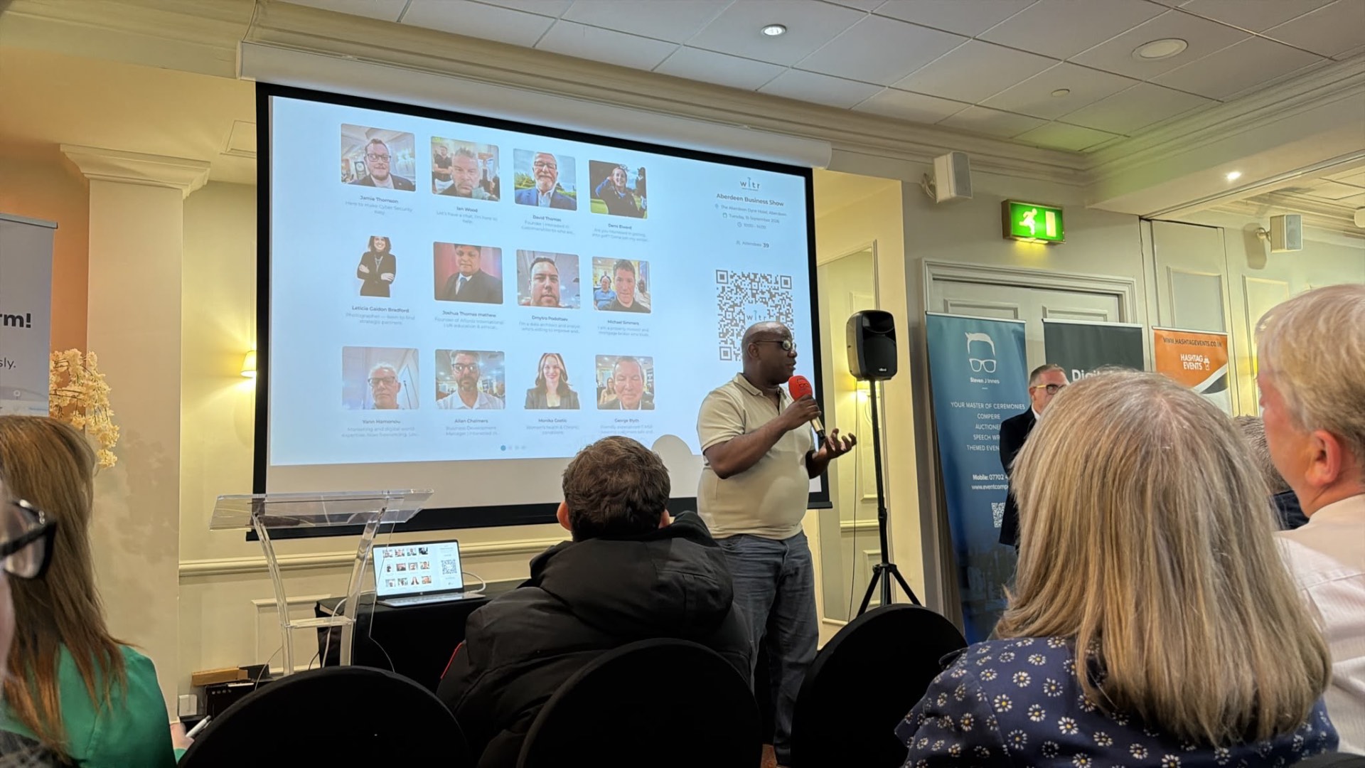 WITR attendee profiles and event QR code projected at a Hashtag Events networking session